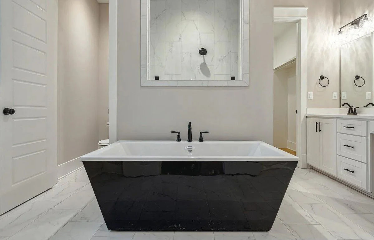 Modern bathroom tub and shelving.